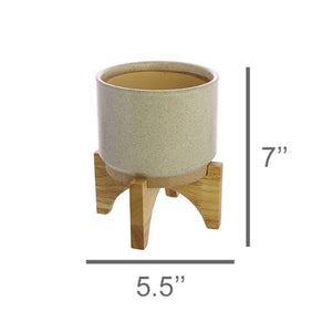 One HomArt Ames Cachepot in light gray with dark speckles throughout sitting on wooden stand against white background. Line below indicates to measure 5.5" across and line to right indicates it measures 7" tall