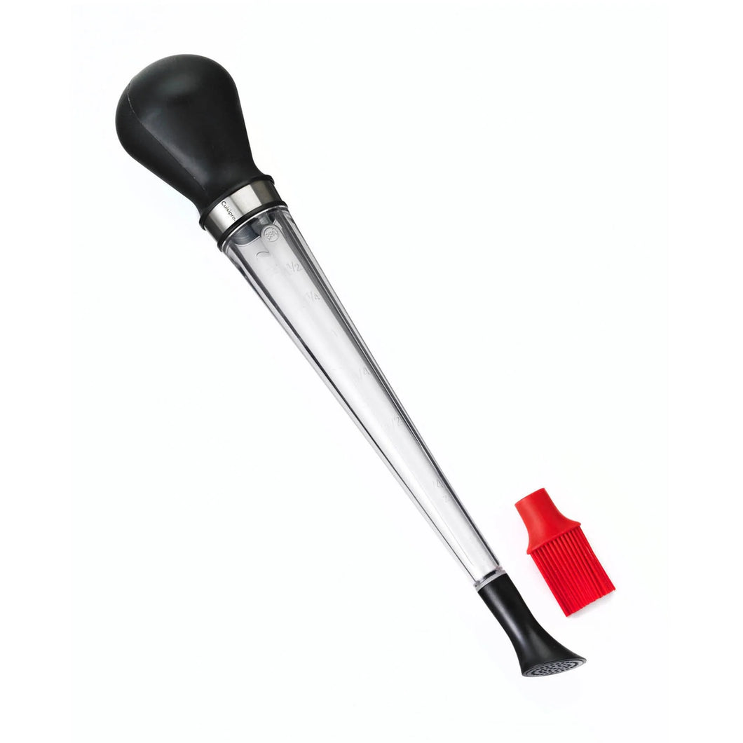 Baster with black ends and clear middle tube. Interchangeable bottom includes a red silicone brush attachment 