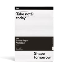 Load image into Gallery viewer, Image of white and black notepad on white background; Thin black line runs across top of notepad with "KARST" printed on top right corner; Below, on white background with black lines running across, reads "Take note today." with a black circle around "Take note"; Large black rectangle runs across pad half way down and reads "KARST" "Stone Paper Notepad" "A4"; Bottom section of pad is white with black lines and in bottom corner, in black, reads "Shape tomorrow."