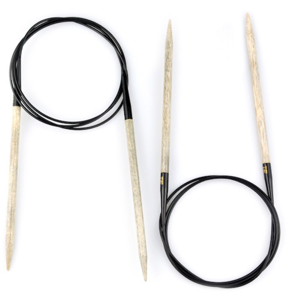 2 pairs of Fixed Circular Needles on white background; Needles shown in light gray driftwood-like color with black cables connecting them