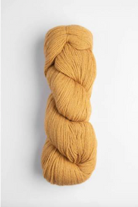 Dark yellow skein of yarn of white background