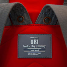 Load image into Gallery viewer, Close up on gray back label of red ORI bag reads &quot;Original ORI London Bag Company, Trade Mark, Fine Quality&quot; in white