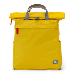 Yellow ORI backpack with gray handles at top and two red zipper tabs on side on white background